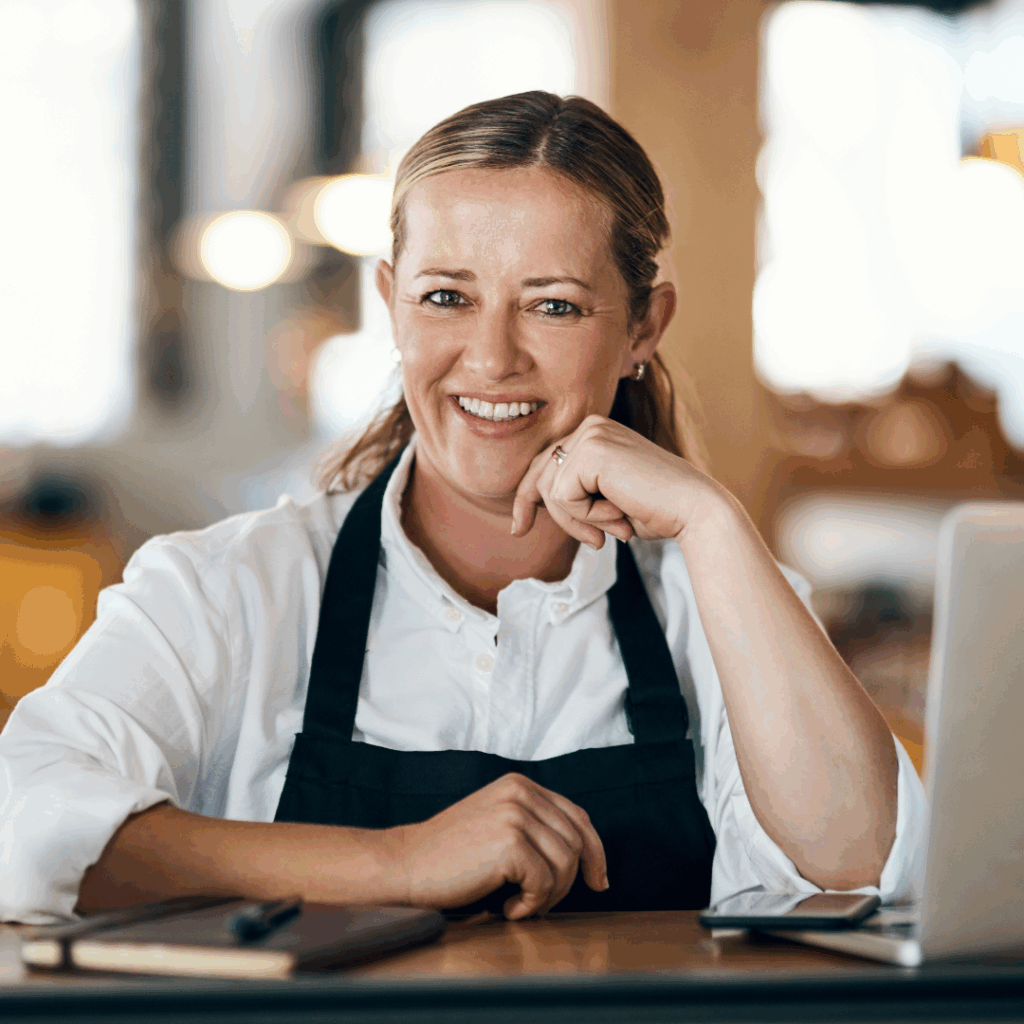 Savona Winter & Festive Opening Hours, showing a woman with her laptop and pad making an order online.
